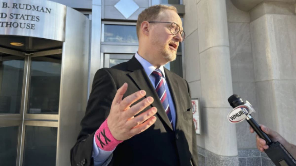 Institute for Free Speech senior attorney Del Kolde pictured wearing an XX wristband similar to what the parents wore.