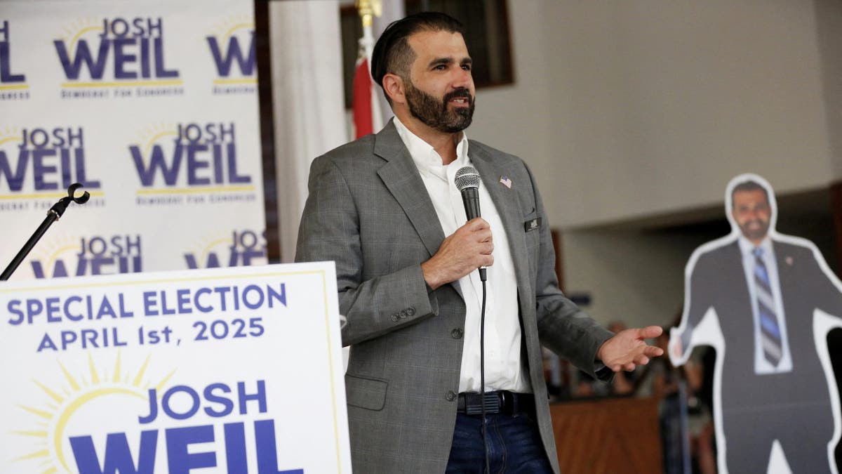 Josh Weil, a schoolteacher and Democratic candidate for Florida's 6th Congressional District seat in the U.S. House of Representatives, speaks at a town hall event in Ocala, Florida, on March 26, 2025.