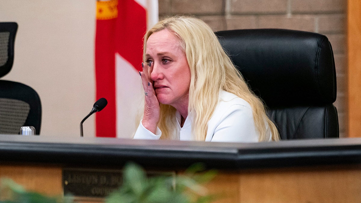 A Fort Myers councilmember cries during a meeting about immigration