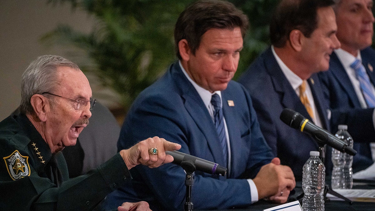 Ron DeSantis and Ric Bradshaw appear at an immigration meeting in Florida