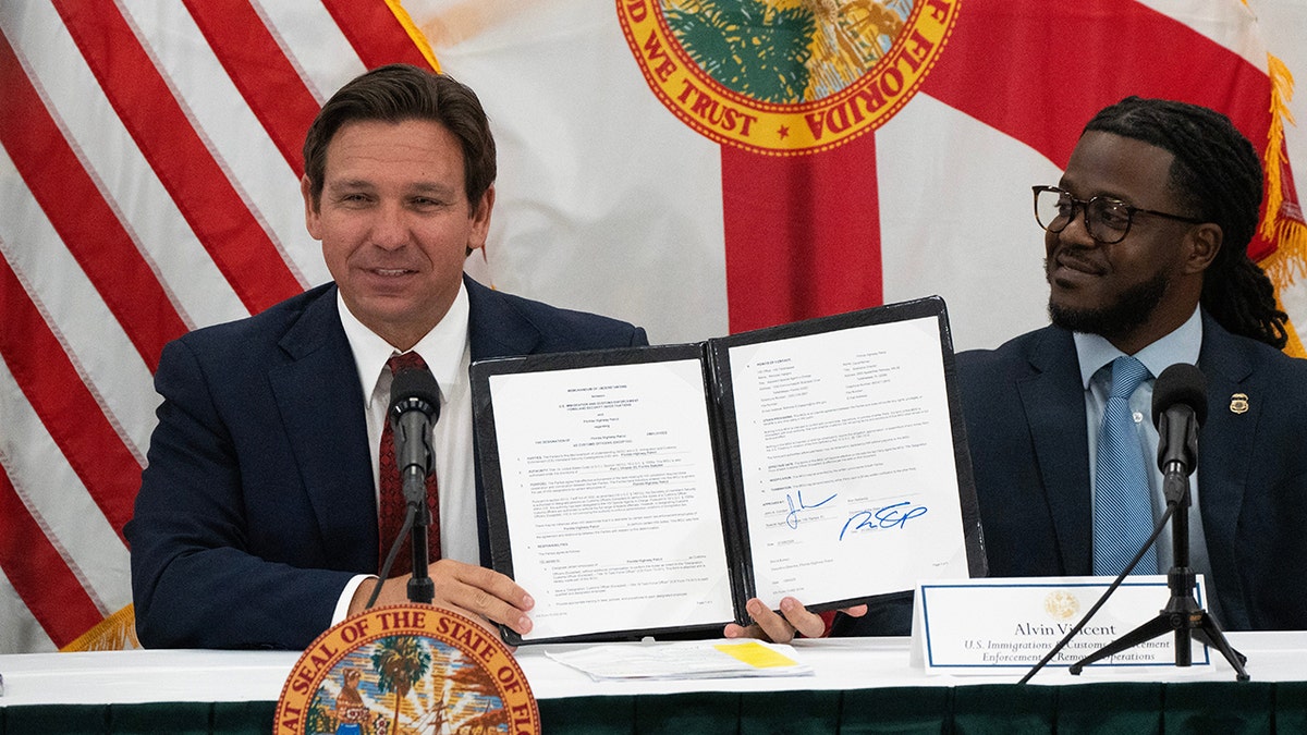 Ron DeSantis appears at an immigration meeting in Florida
