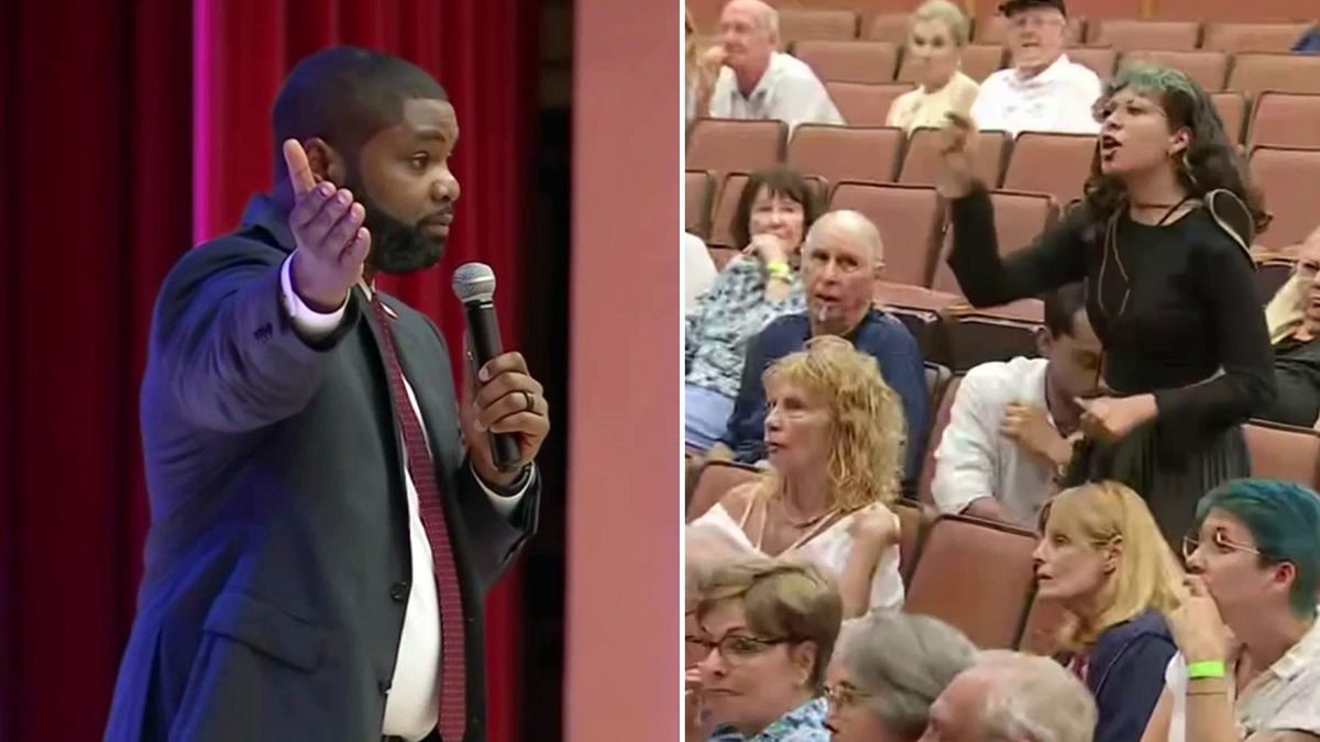 Bryon Donalds argues with protester at town hall