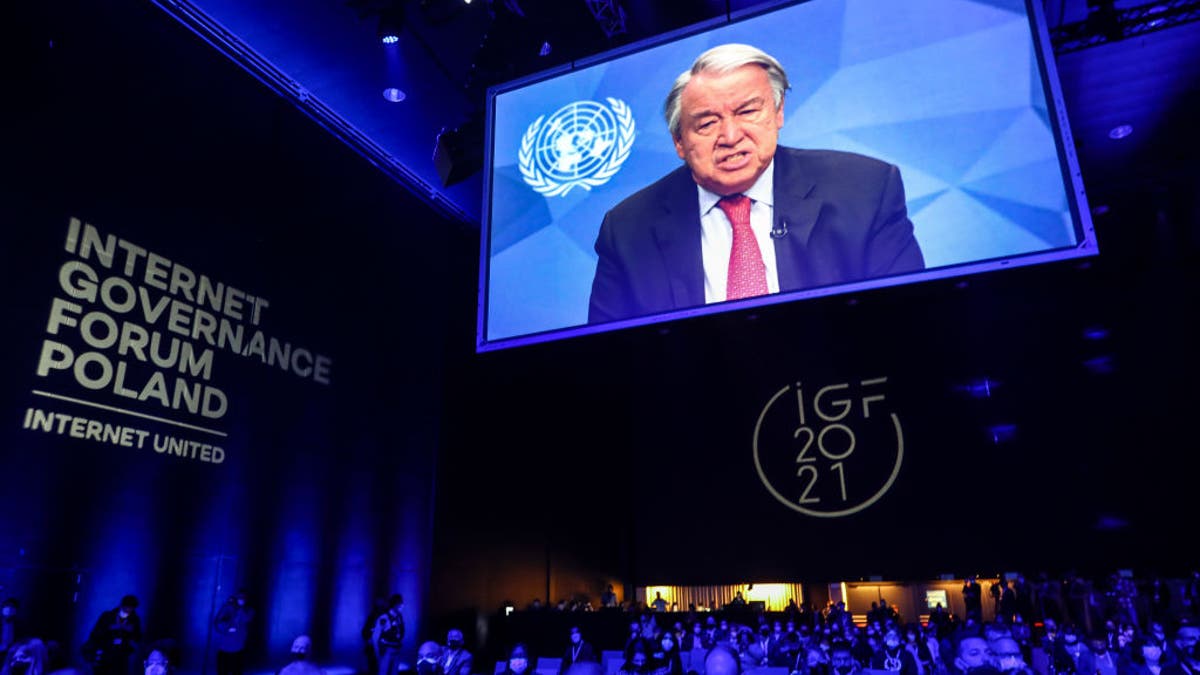United Nations Secretary-General António Guterres is shown on the screen while speaking at the opening ceremony of the UN Internet Governance Forum - IGF 2021 at the International Congress Center in Katowice, Poland, on December 7th, 2021. 