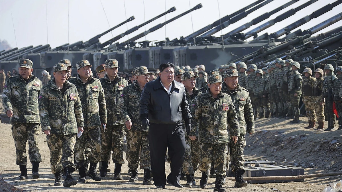Kim Jong Un with North Korean troops