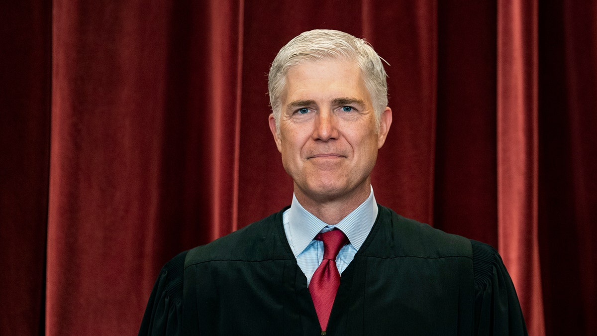 Justice Neil Gorsuch in his robe for Supreme Court group photo