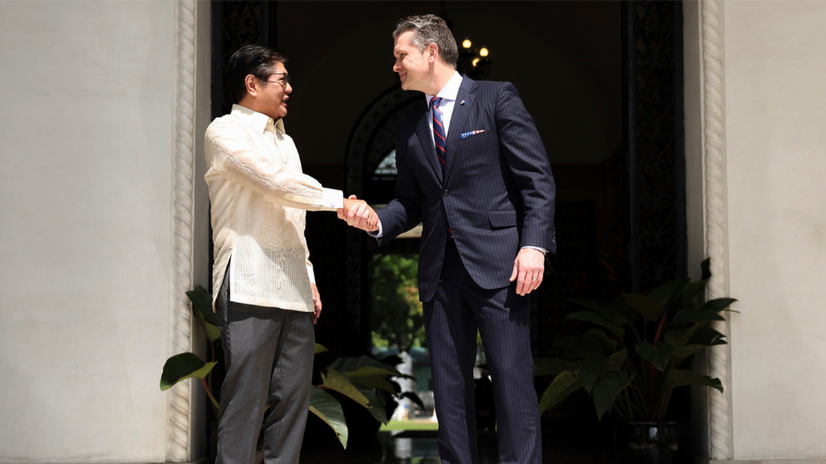 Marcos shakes hands with Hegseth