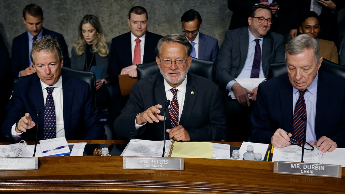 Sen. Rand Paul, Gary Peters, Richard Durbin speak during a Senate committee hearing
