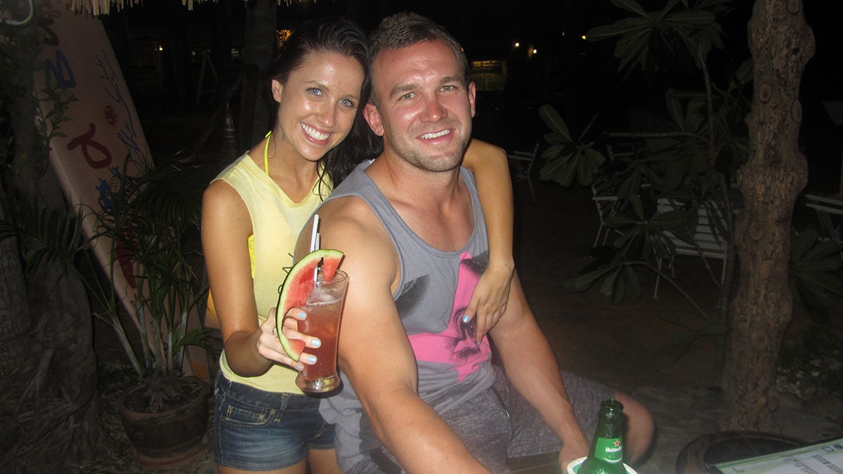 Nicole Fitzsimons poses for a photo in Thailand with her boyfriend