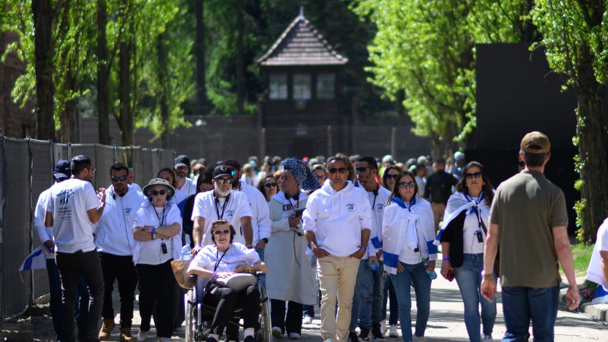 Oct 7 survivors at Auschwitz
