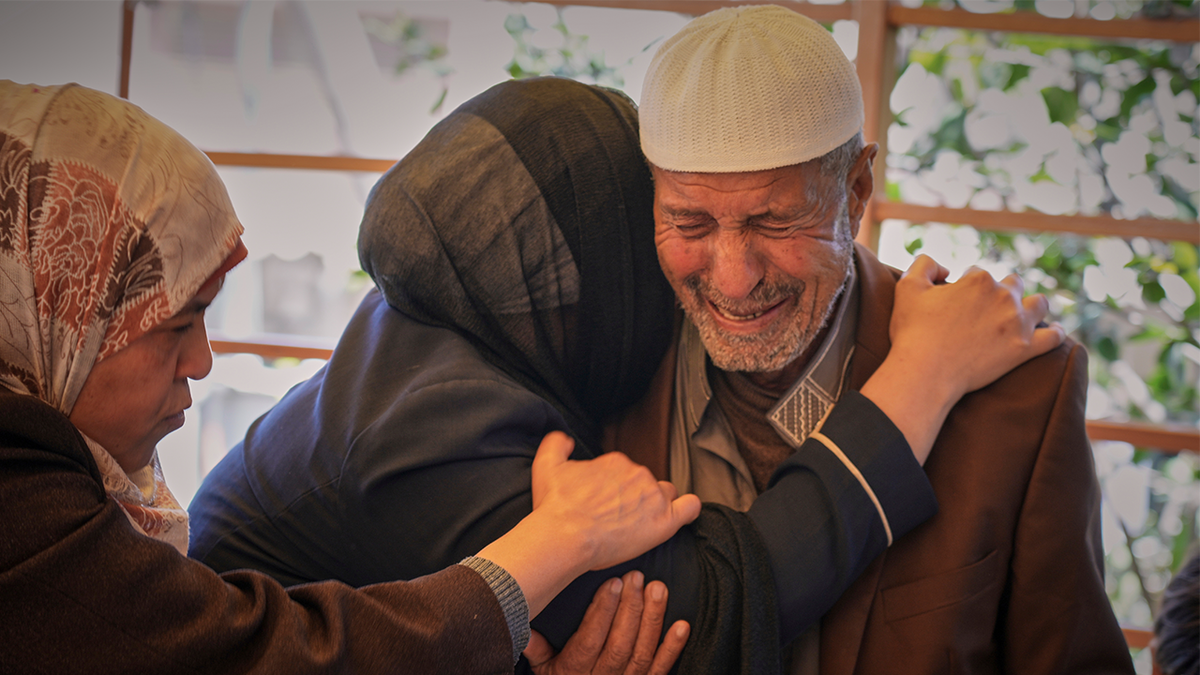Hassan Abu Sultan mourns over the body of her son Jehad