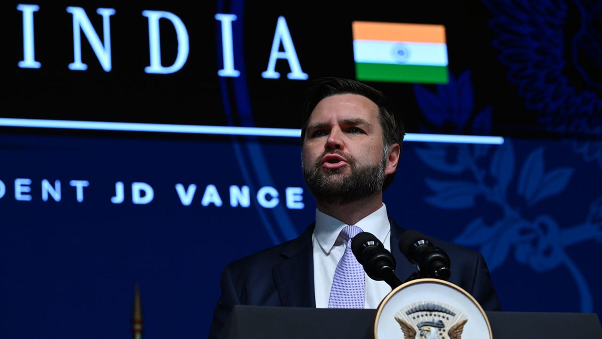 Vance speaks on stage in Jaipur, India