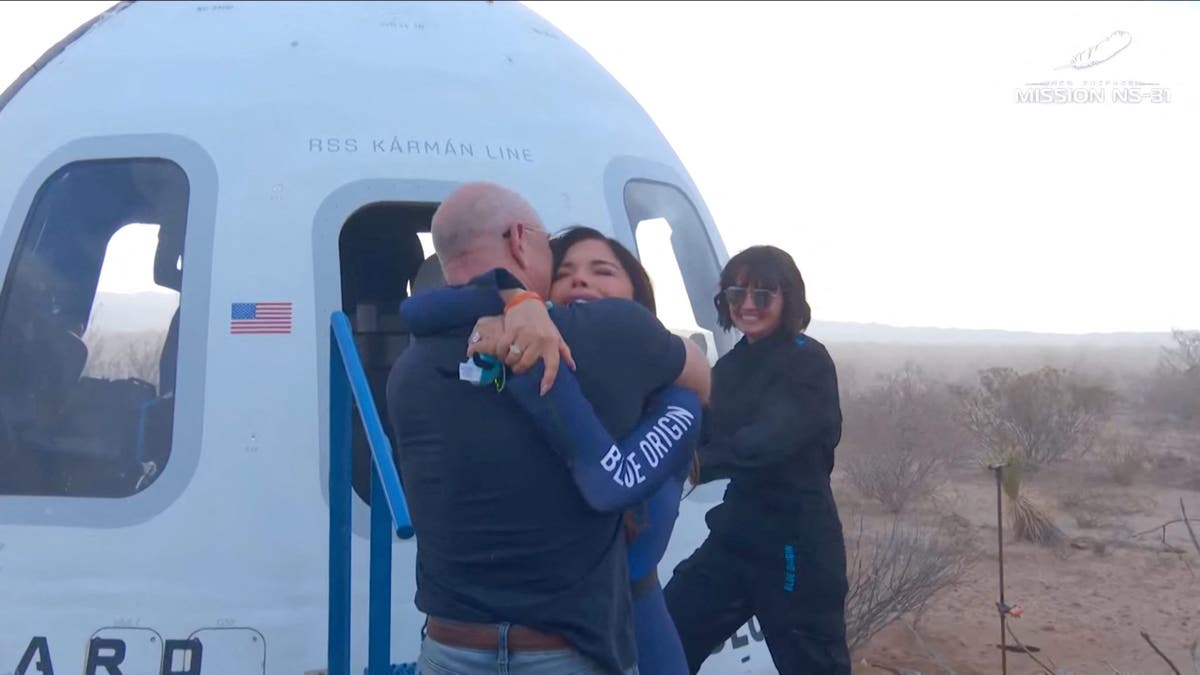 Lauren Sanchez and Jeff Bezos hug