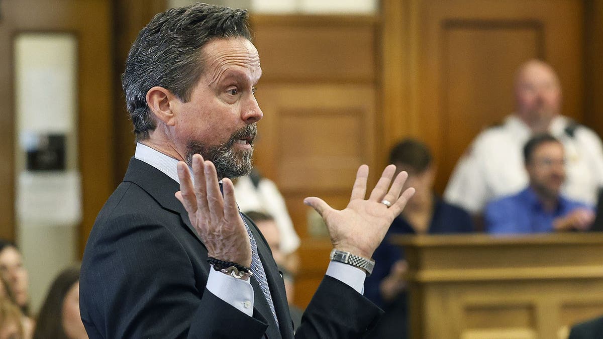 Defense attorney Alan Jackson gestures with both hands while questioning Jen McCabe