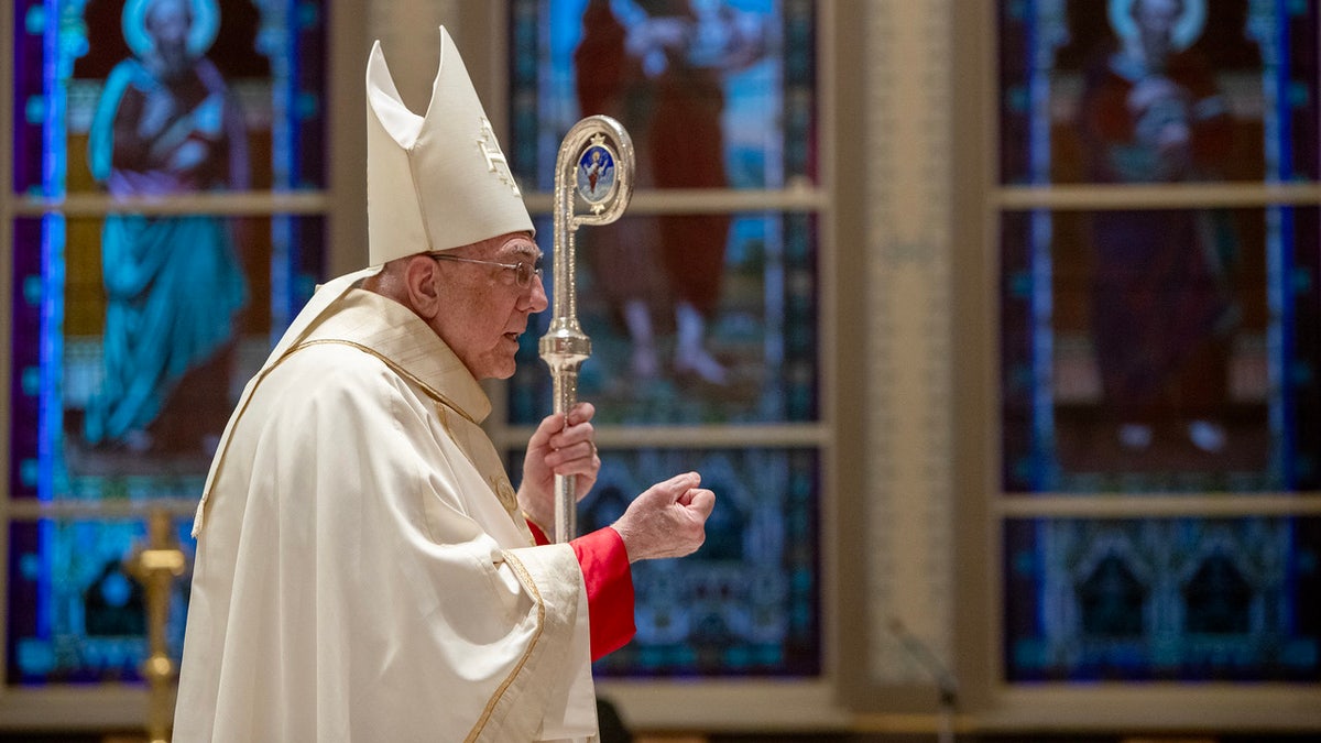 Archbishop Joseph Naumann leads a mass 