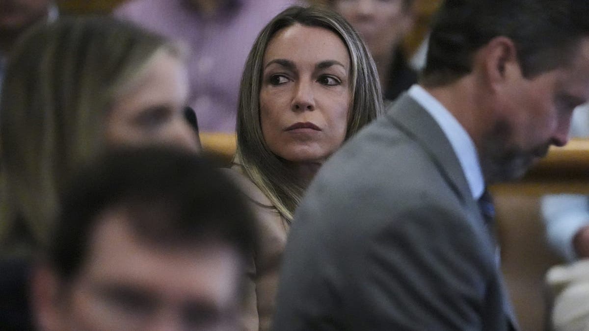 Karen Read listens to testimony during her trial while seated behind her attorneys Joe Alessi and Alan Jackson