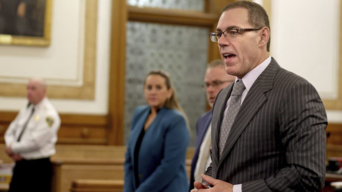Prosecutor Hank Brennan introduces himself to jury