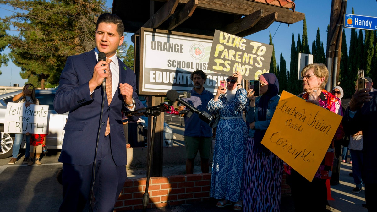 Bill Essayli speaks to a group of protesters