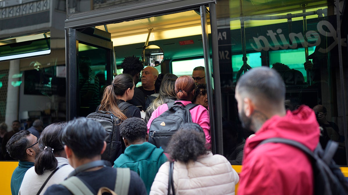 People boarding a bus in Madrid