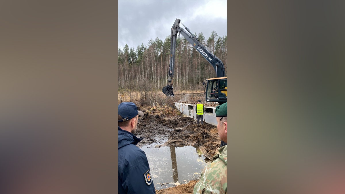 Recovery Efforts Continue at Site of Submerged Vehicle in Search for Missing Soldiers