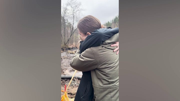 Lithuanian defense minister hugs US ambassador at search site