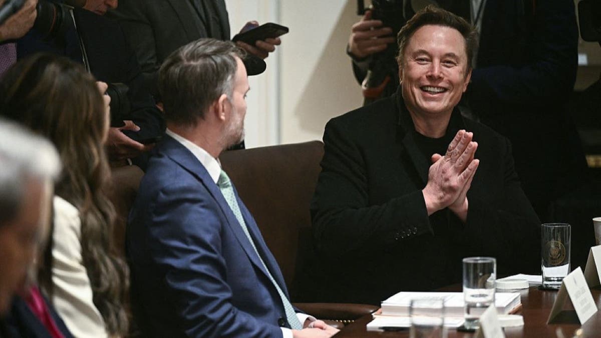 Elon Musk (R) attends cabinet meeting with US President Donald Trump in the Cabinet Room of the White House on April 10, 2025, in Washington, DC. Trump on Thursday warned of the "transition cost" from his tariff policies, as Wall Street stocks fell again over the worsening trade war with China. (Photo by Brendan SMIALOWSKI / AFP) (Photo by BRENDAN SMIALOWSKI/AFP via Getty Images)