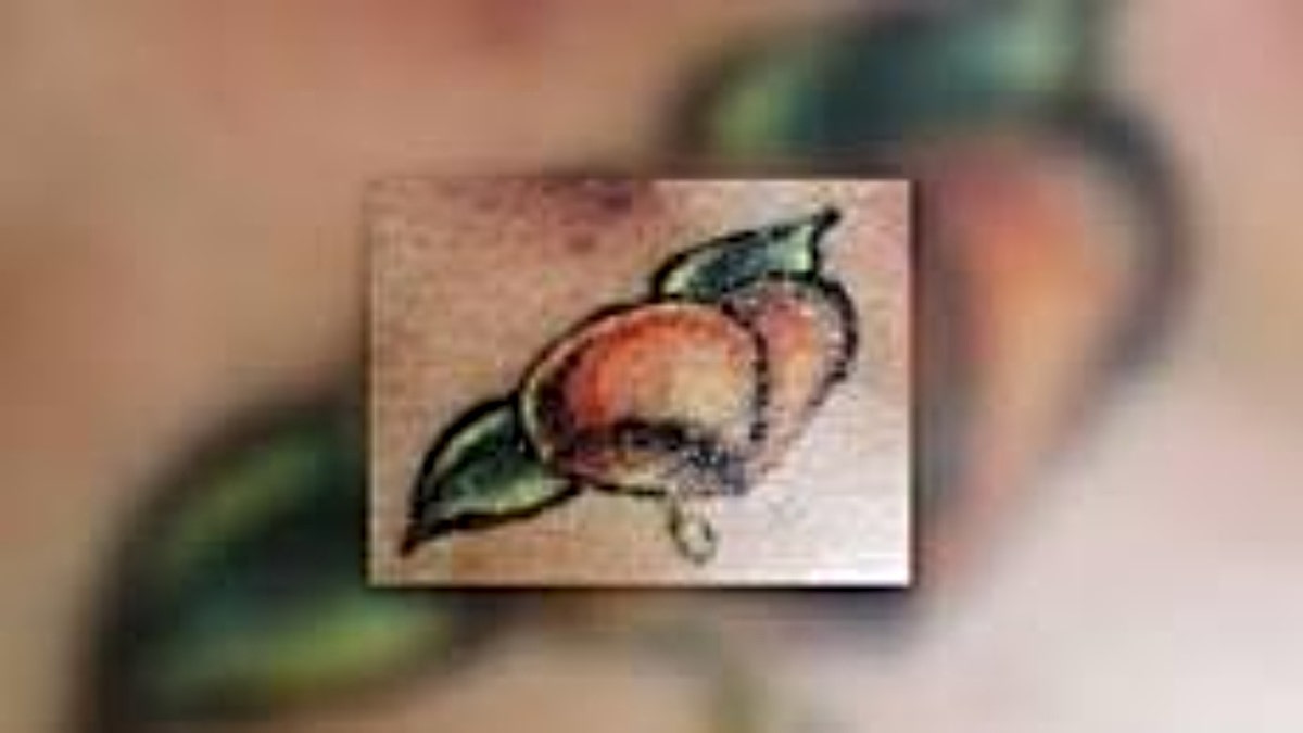 Tanya Jackson's peach tattoo