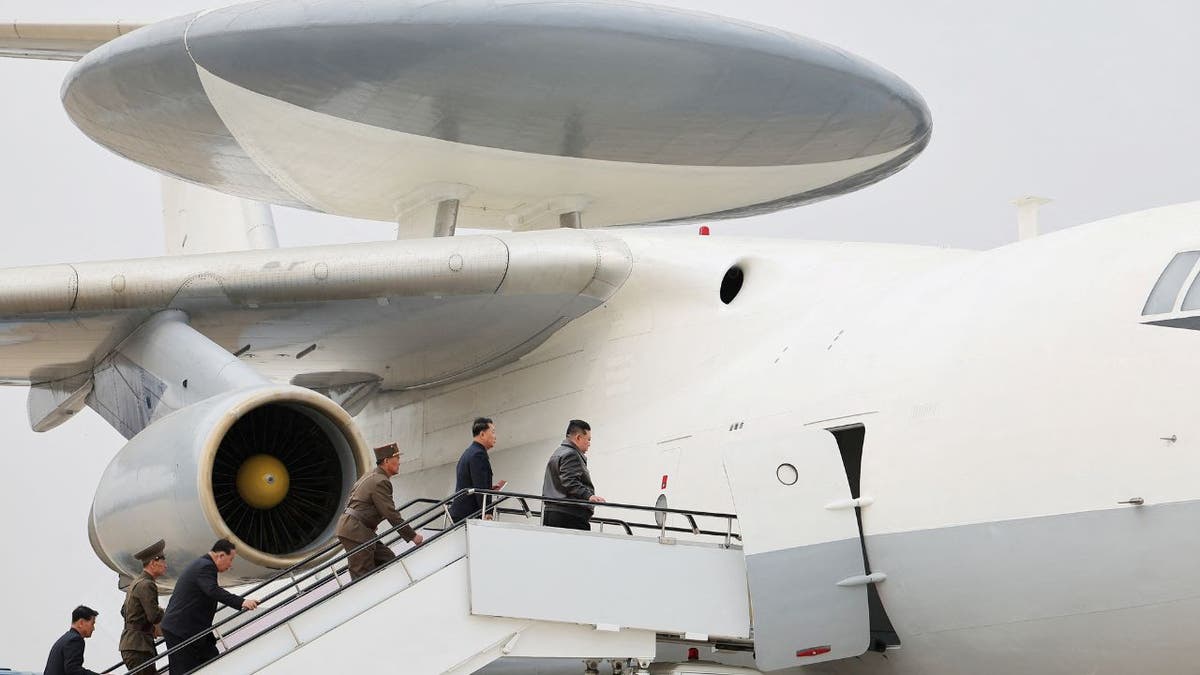 North Korean leader Kim Jong Un boards an aircraft