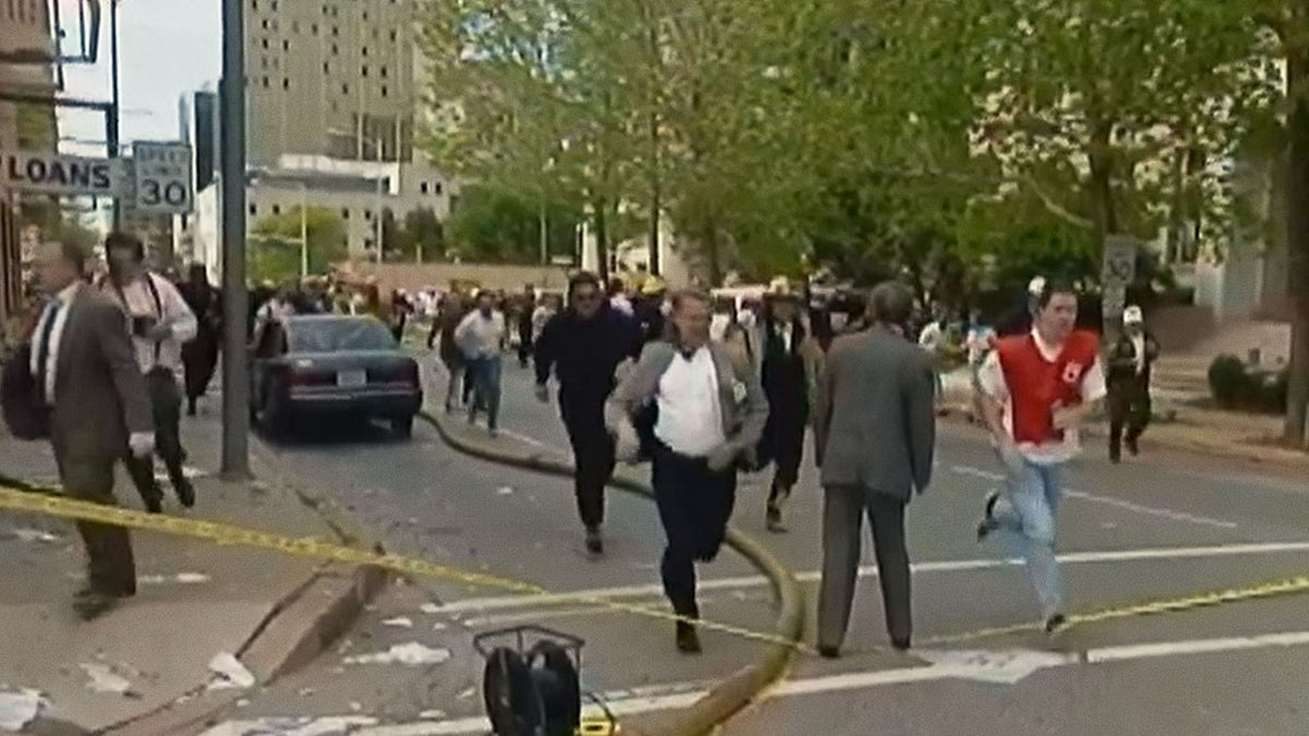 People running in the streets after the Oklahoma City bombing.