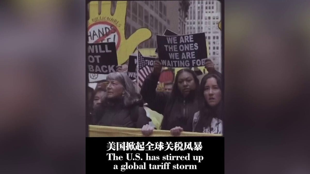 Street protest scene with signs and the caption 