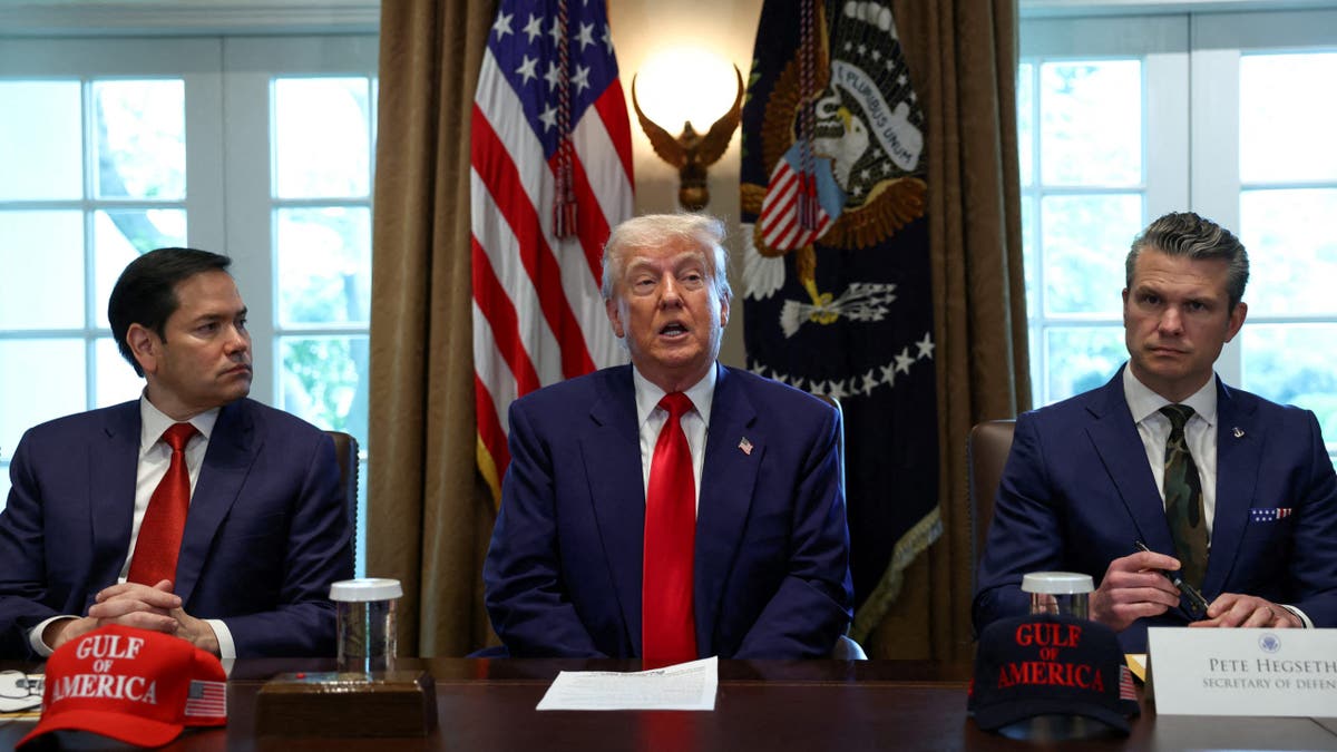 U.S. President Donald Trump speaks next to U.S. Defense Secretary Pete Hegseth and U.S. Secretary of State Marco Rubio during a cabinet meeting at the White House in Washington, D.C., U.S., April 30, 2025