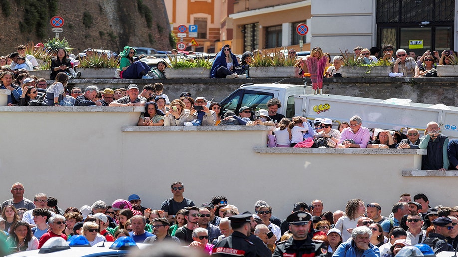People gathering outside of the Vatican