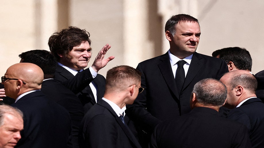 Argentinian President Javier Milei waves