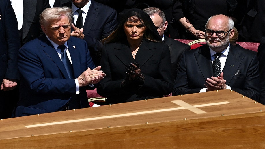 President Trump and First Lady Melania Trump in front of Pope Francis' coffin