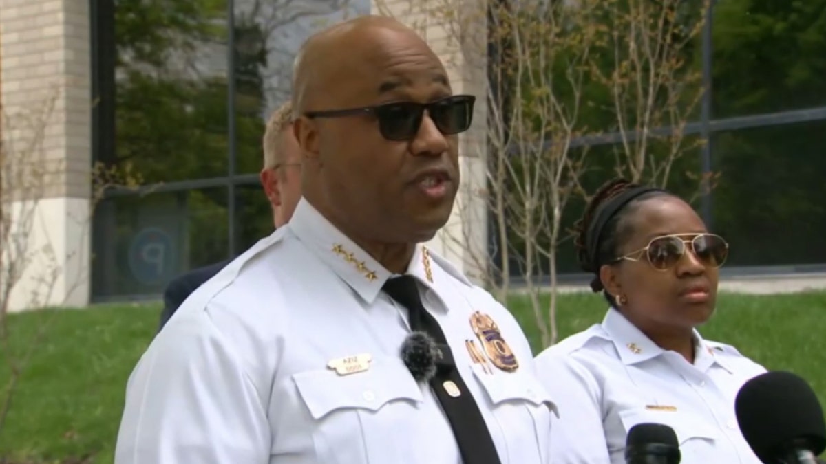 police chief wearing sunglasses speaking to press