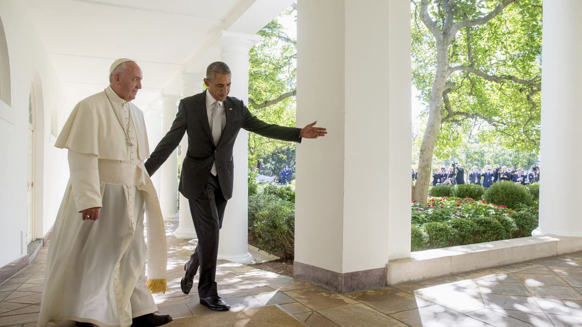 President Barack Obama and Pope Francis walk down the Colonnade before meeting in the Oval Office of the White House in Washington on Sept. 23, 2015. 