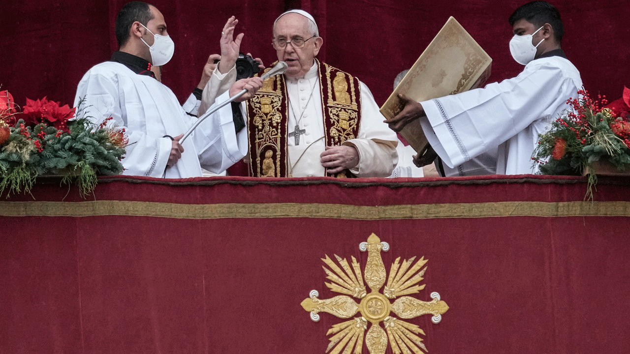Pope Francis delivers the Urbi et Orbi (Latin for ‘to the city and to the world’ ) Christmas’ day blessing from the main balcony of St. Peter’s Basilica at the Vatican, Saturday, Dec. 25, 2021. (AP Photo/Gregorio Borgia)