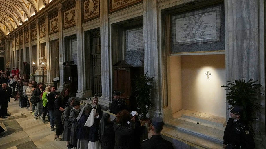 Crowds file past the tomb of Pope Francis