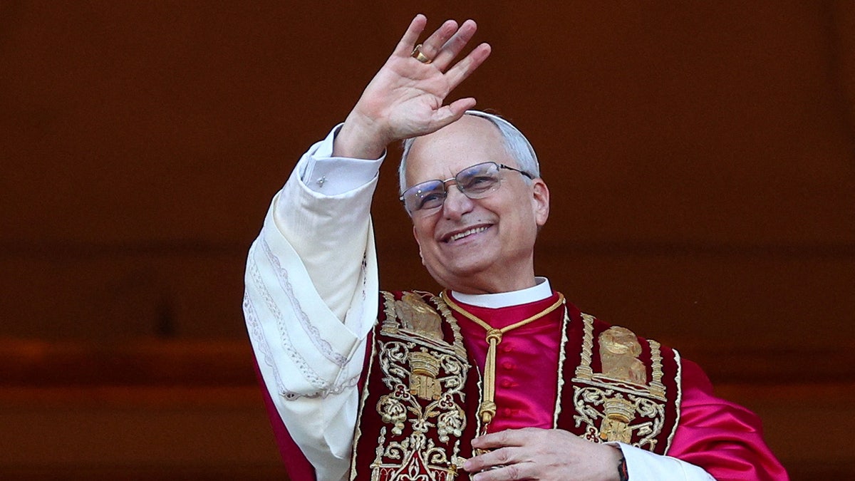 Pope Leo XIV waves and smiles to Vatican City