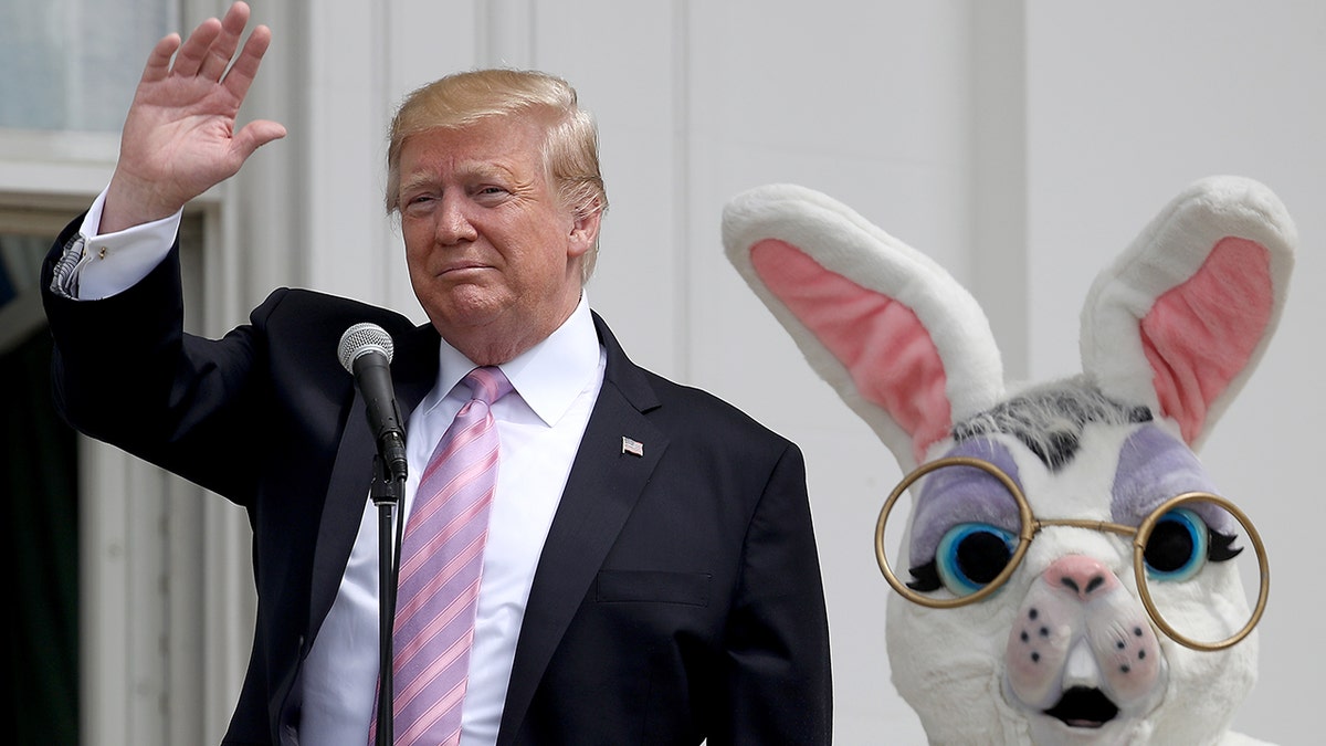 President Donald Trump with someone dressed as an Easter bunny in 2019