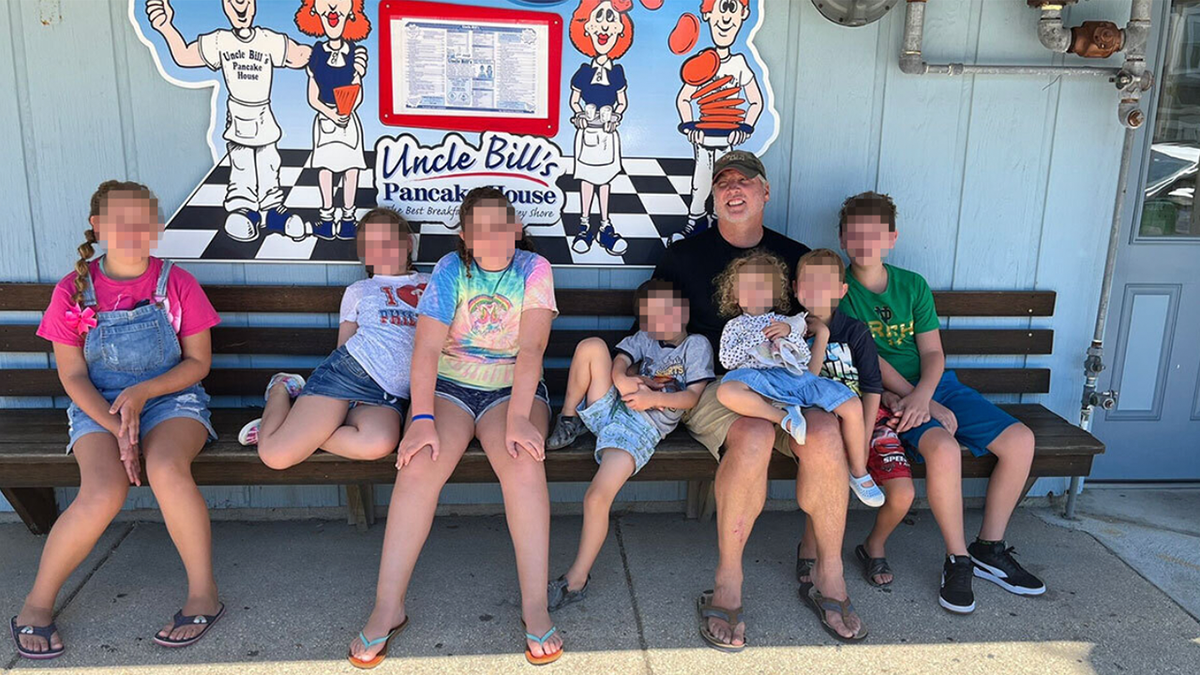 Houck on bench with kids