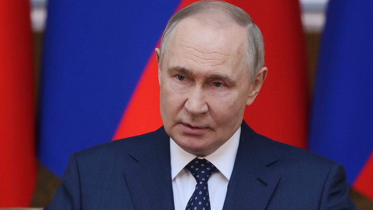 Russian President Vladimir Putin in dark suit