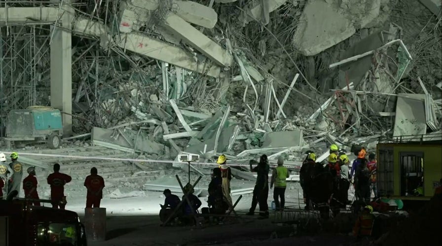 First responders clear leveled apartment building in Thailand after powerful earthquake