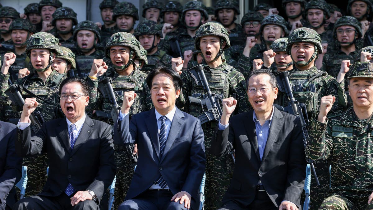 Taiwanese National Security Council Secretary-General Joseph Wu, President William Lai and Defense Minister Wellington Koo are shown at the Songshan military airbase in Taipei on March 21, 2025.