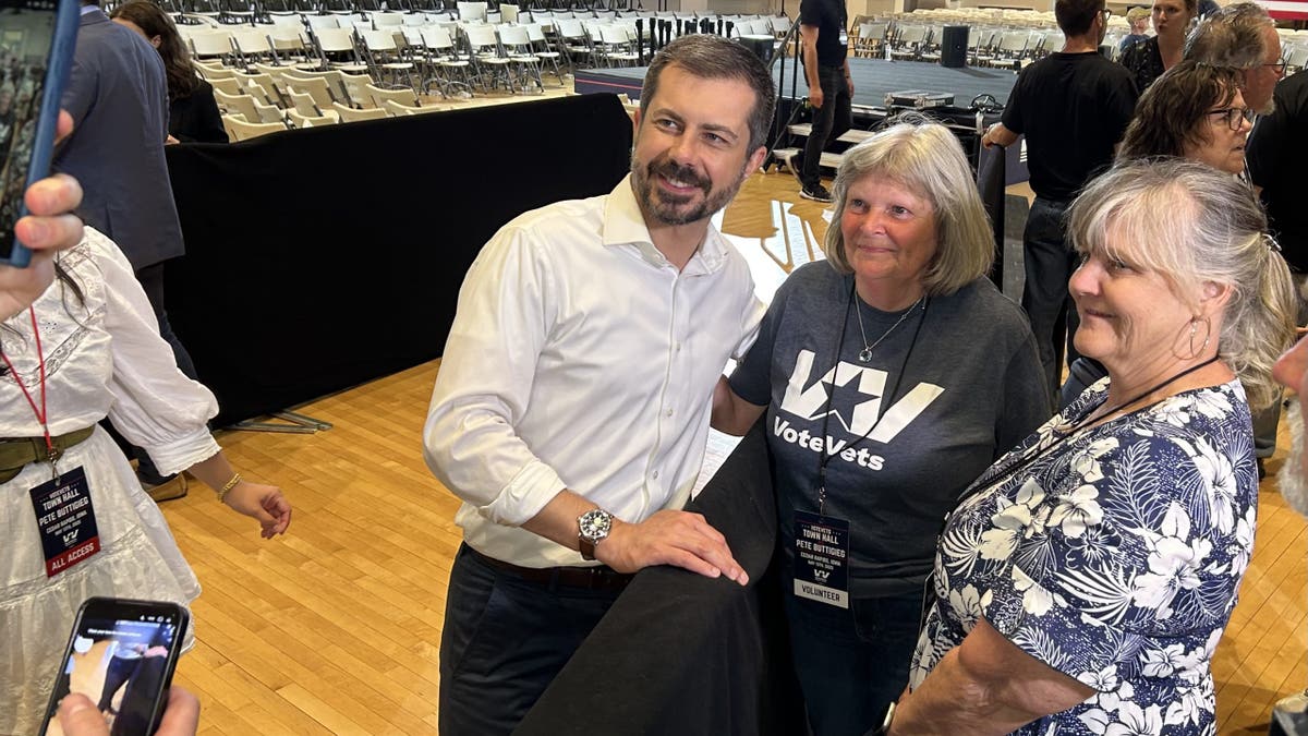 Former Transportation Secretary Pete Buttigieg greets members of the audience along the rope line following a town hall with veterans, on May 13, 2025 in Cedar Rapids, Iowa.
