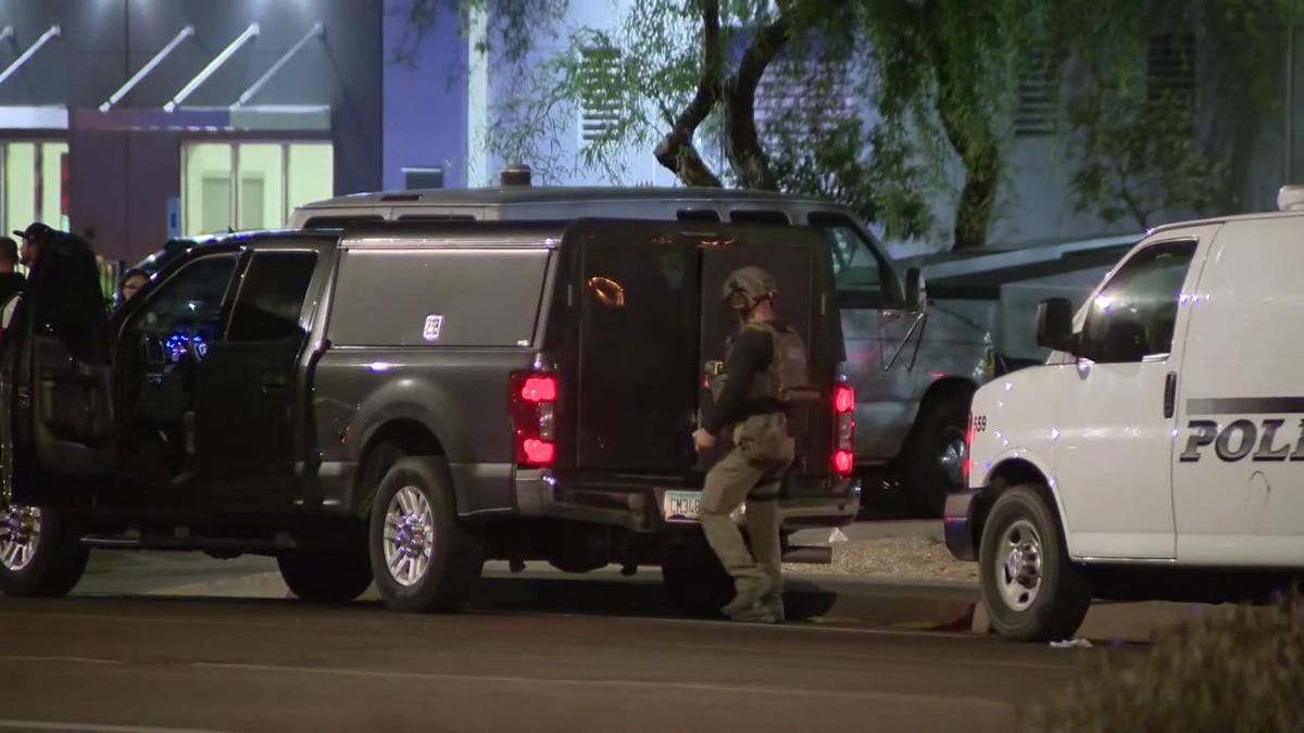 Police and federal authorities emerge from their vehicle