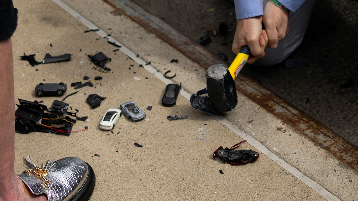 Tesla toys are smashed at a protest in New York City