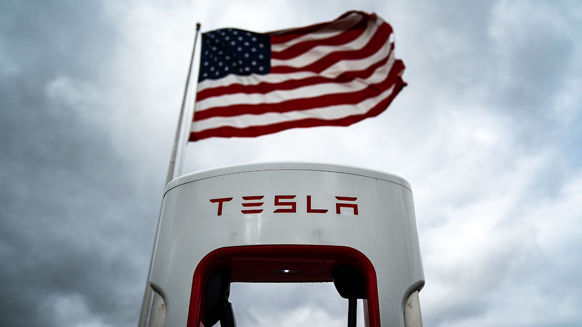 Tesla supercharger with flag
