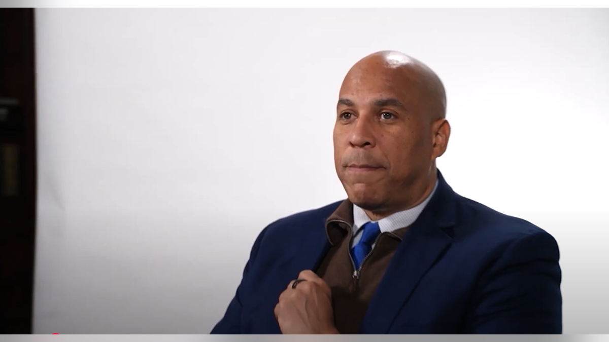 Cory booker sits for a video