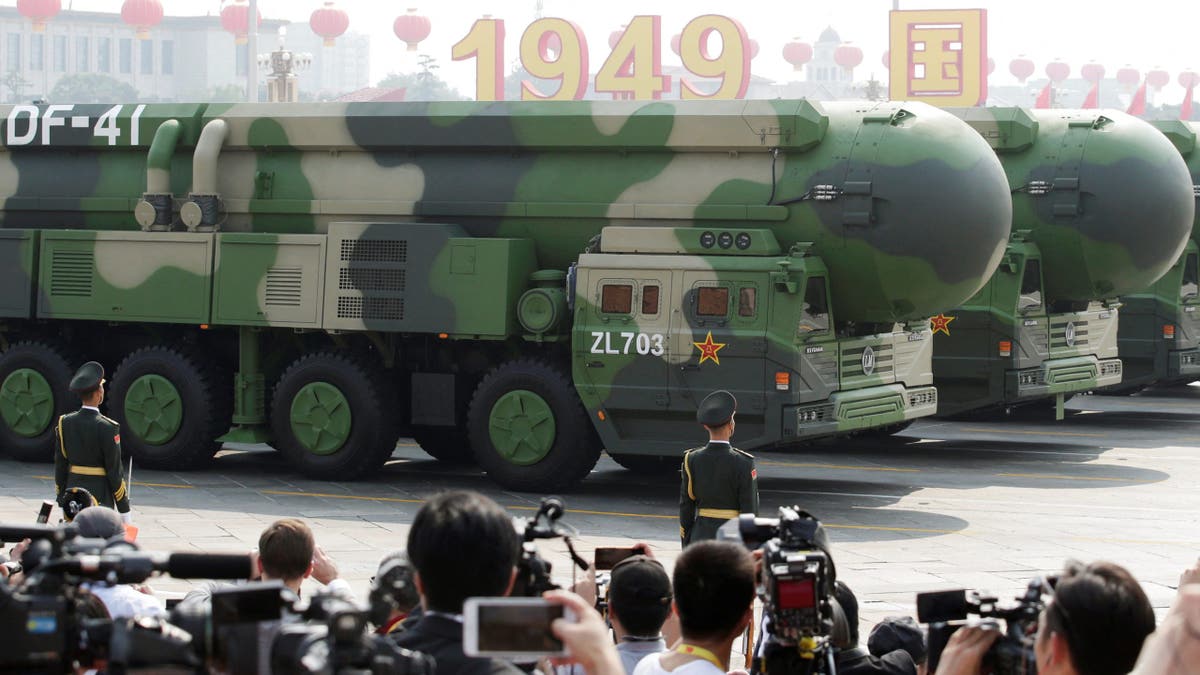 Military vehicles carrying DF-41 intercontinental ballistic missiles travel past Tiananmen Square during the military parade marking the 70th founding anniversary of People's Republic of China, on its National Day in Beijing, China 