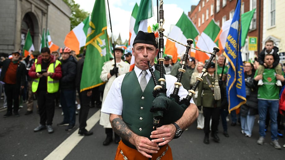 Bag pipe player leads Dublin march